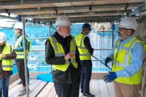 Dean John Davies discusses West Front conservation work in situ with Clerk of the Works, Jez Fry, 2021 (Image: David Bevan)